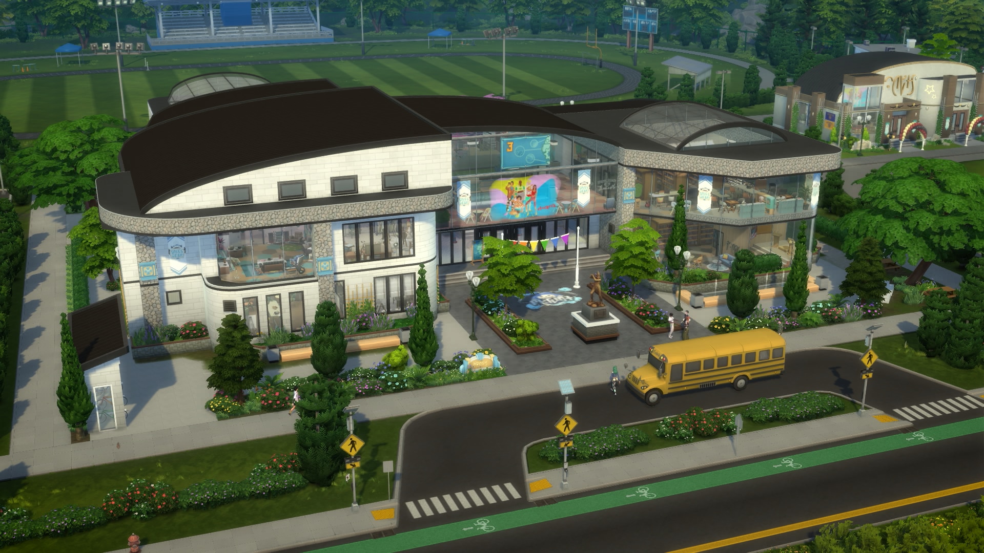 Exterior of Copperdale High School from The Sims 4 High School Years, showing the modern multi-story building, courtyard, and yellow school