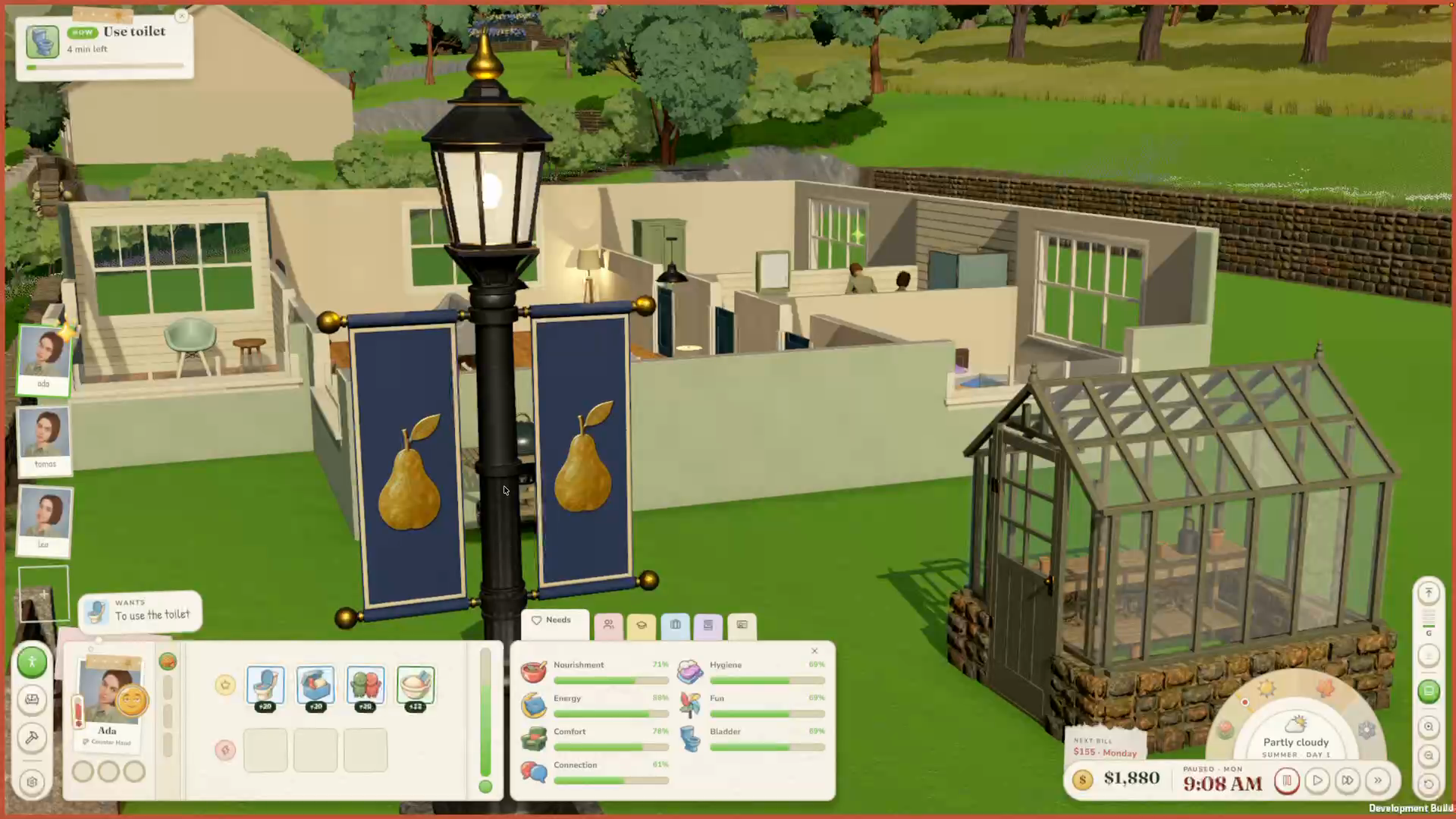 Goodhaven’s pear-banner streetlamp beside a greenhouse in the Game Log #2 development build.