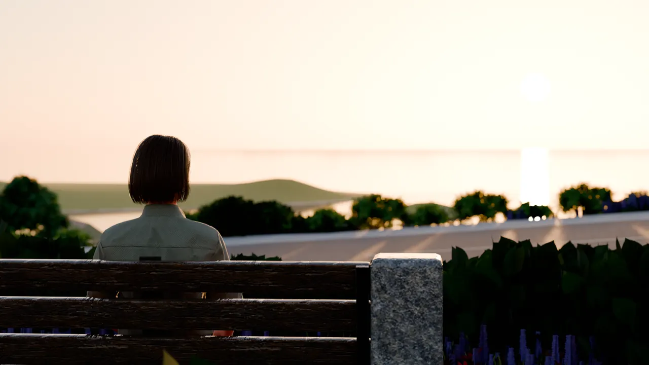 Mika, seen from behind, sits on the Overlook bench at sunset, looking out over the bay.