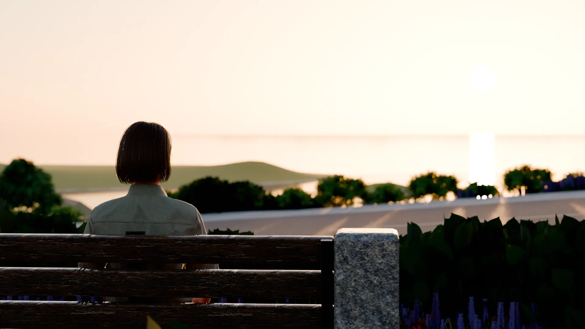 Mika, seen from behind, sits on the Overlook bench at sunset, looking out over the bay.